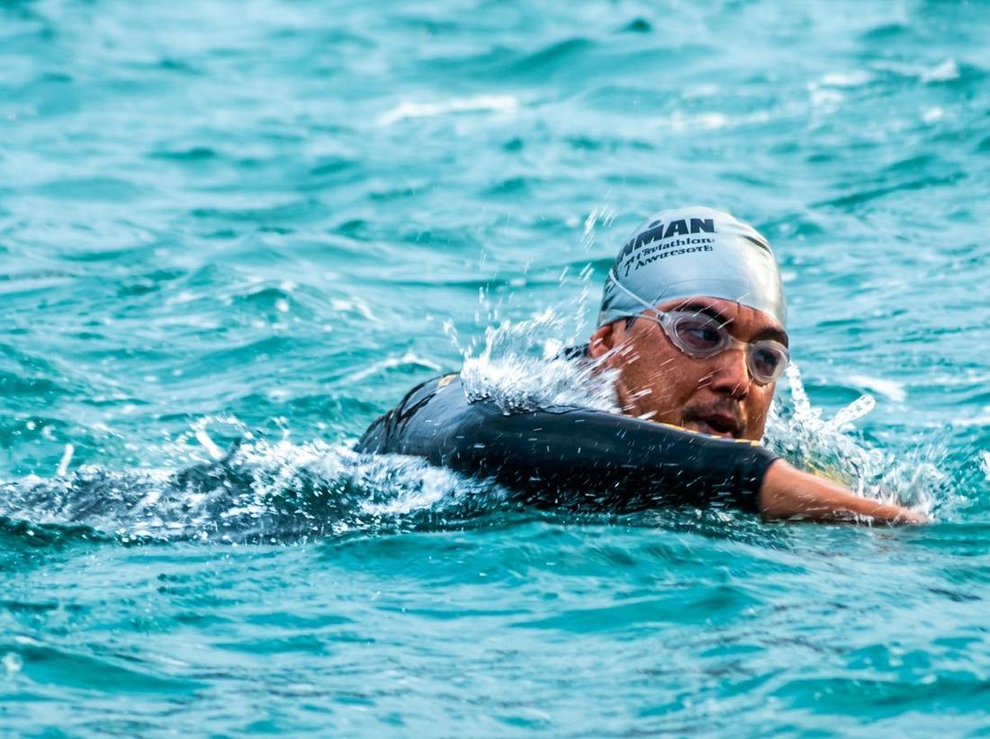 Marlon mid-stroke in Ironman open water swim